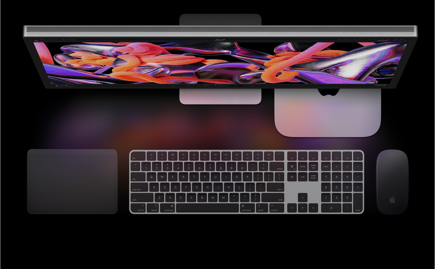 Bovenaanzicht van Studio Display, Mac mini, Magic Trackpad, Magic Keyboard en Magic Mouse.